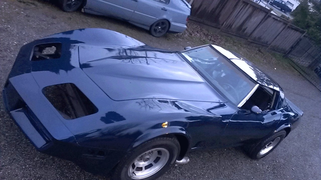 Electric Blue Corvette painted over black base coat. True Custom Paint.