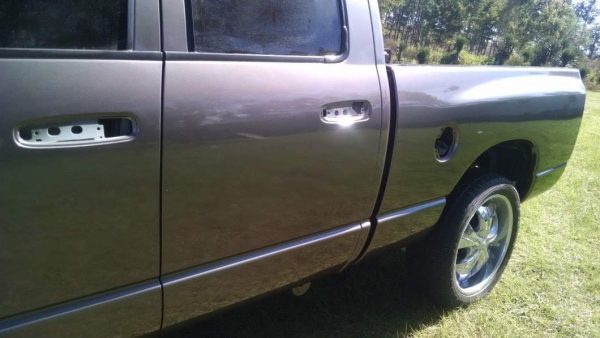 Red Phantom Pearl on a grey colored truck